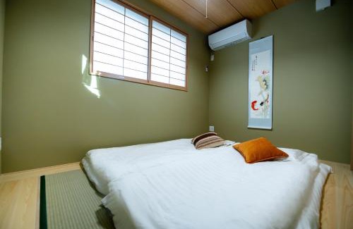 Nishi Villa | 大阪ドーム徒歩10分、九条駅から3分、難波直通6分、海遊館7分、USJ11分