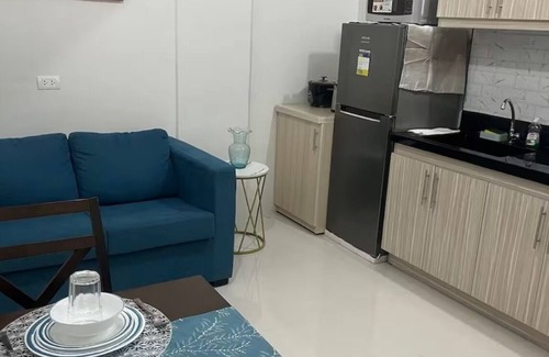 Basak Condominio | 1 bedroom condo living room and kitchen sleeps 4 EARLY CHECK IN -LATE CHECK OUT
