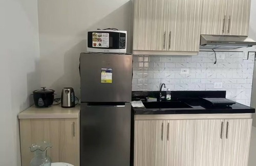 Basak Condominio | 1 bedroom condo living room and kitchen sleeps 4 EARLY CHECK IN -LATE CHECK OUT