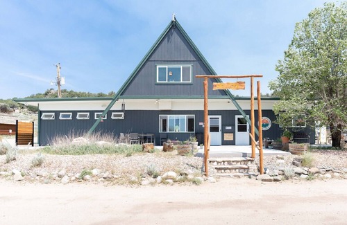 Buena Vista Cabina | 1 Room Dry Camping Cabin. Sleeps up to 4 in one queen bed and a set of twin bunks.