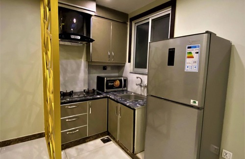 Bahria Town Apartamento | 101 - Experience Luxury Living with Modern Amenities
