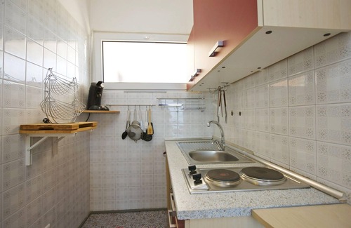Villaggio Belmonte Apartamento | Apartamento de 1½ habitaciones con balcón y vista al lago impresionante en una residencia con piscina