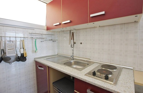 Villaggio Belmonte Apartamento | Apartamento de 1½ habitaciones con balcón y vista al lago impresionante en una residencia con piscina