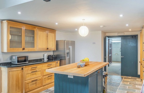 Pembroke Cabaña | The ultimate celebration house full of character with a bar, studio, pool table and table tennis.
