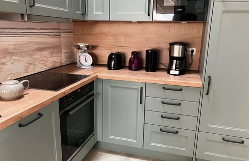 Norderteil Casa | 12 person family holiday home with sauna, whirlpool, two showers and toilets, wood-burning stove and canoe in 1st row to the lake with wonderful lake view in Otterndorf