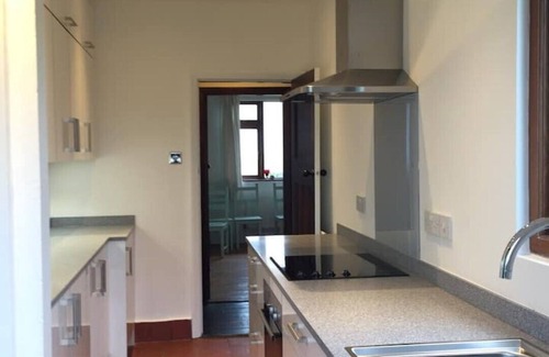 Ty Croes Casa | 1930's bungalow nr Rhosneigr, opposite beach, large garden and amazing views.