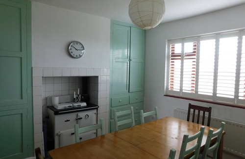 Ty Croes Casa | 1930's bungalow nr Rhosneigr, opposite beach, large garden and amazing views.