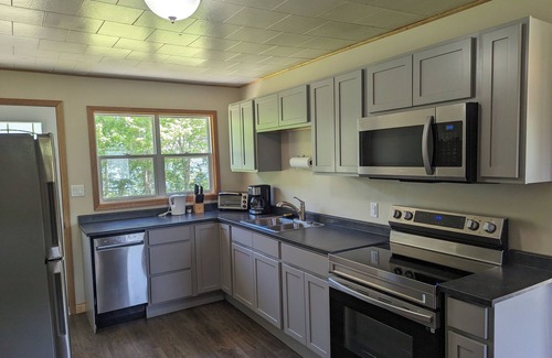 Inverness County Cabaña | 2-Bedroom Cottage On Lake Ainlsie Private Beach, Enjoy Fishing & Swimming.