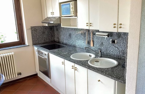 Luogo Ameno Apartamento | 2-room apartment with balcony and terrace in a park with pool