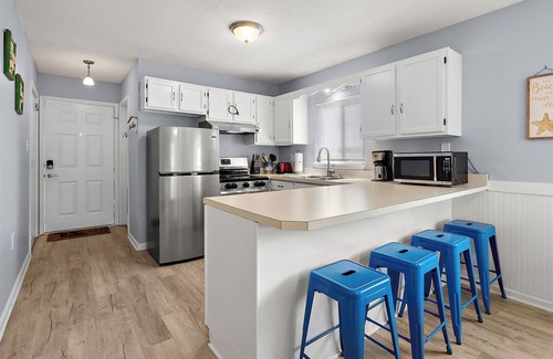 Caine Woods Casa | 2BR Family Friendly Condo w/Large Balcony, Partial Ocean Views, Outdoor Pool