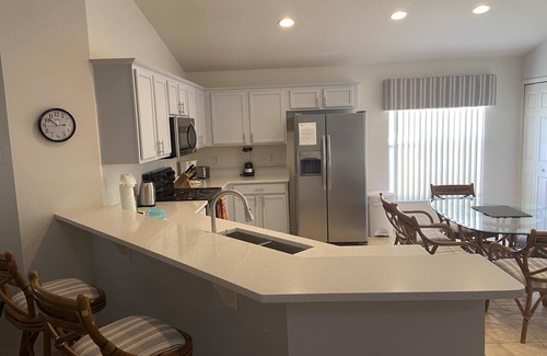Kissimmee Casa | Casa con piscina de 4 dormitorios con vista de conservación en la comunidad cerrada de golf de Remington