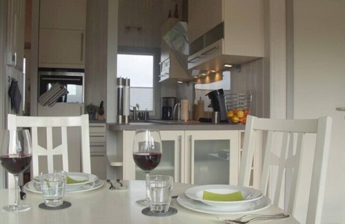 Norderteil Casa | 4 person luxury holiday home with sauna, wood-burning stove, air conditioning, canoe and lake view in Otterndorf