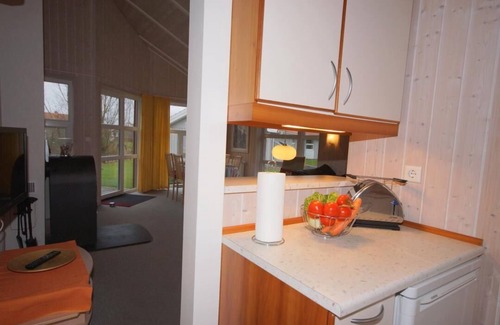 Norderteil Casa | 4-person vacation home with private jetty, direct lakeside location, canoe, sauna and wood-burning stove in Otterndorf