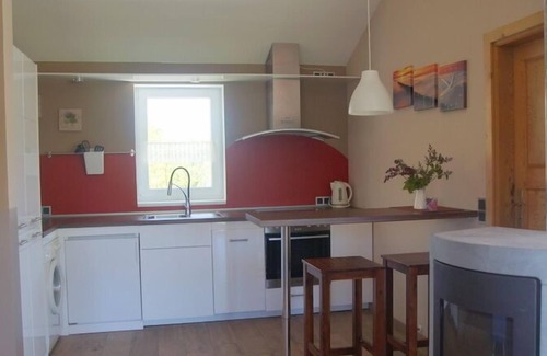 Norderteil Casa | 4 person vacation home with wood-burning stove, conservatory and canoe, with a wonderful view of the lake in Otterndorf