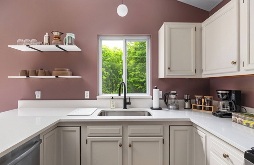 Traverse City Casa | 4bdr 2 bath house. Unwind in the hot tub, chat around the fire pit and disc golf