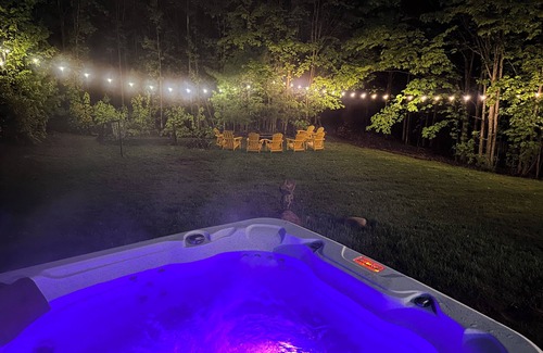 Traverse City Casa | 4bdr 2 bath house. Unwind in the hot tub, chat around the fire pit and disc golf