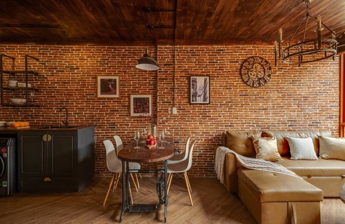 Downtown Ho Chi Minh City Casa | 4BR Industrial Gem with Rooftop Garden by Bến Thành