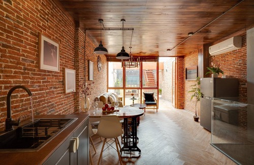 Downtown Ho Chi Minh City Casa | 4BR Industrial Gem with Rooftop Garden by Bến Thành