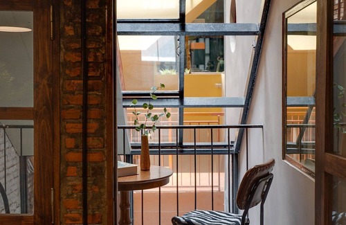 Downtown Ho Chi Minh City Casa | 4BR Industrial Gem with Rooftop Garden by Bến Thành
