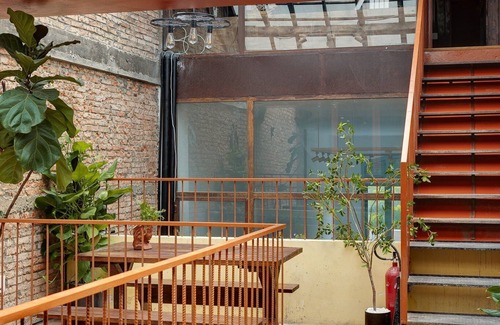 Downtown Ho Chi Minh City Casa | 4BR Industrial Gem with Rooftop Garden by Bến Thành