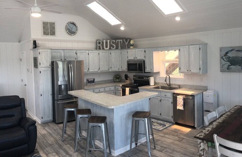 Carova Beach Casa | 4X4 only! Canal front. Ocean AND sound views! Decks and porches on all levels.