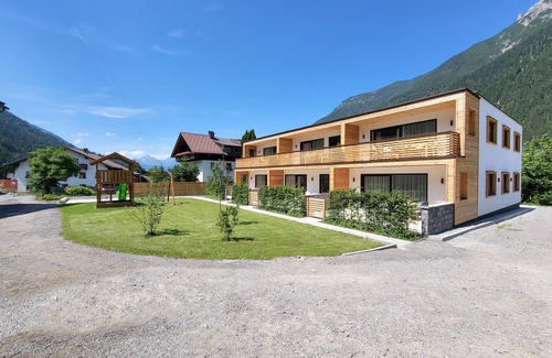 Bichlbach Apartamento | 50m² modern vacation apartment with terrace, free bathing lake, 100m to the ski area