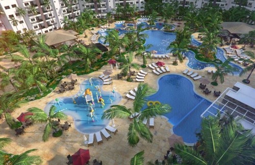 Caldas Novas Apartamento | 54 m² apartment, 2 bedrooms (1 suite), balcony, kitchenette and living room