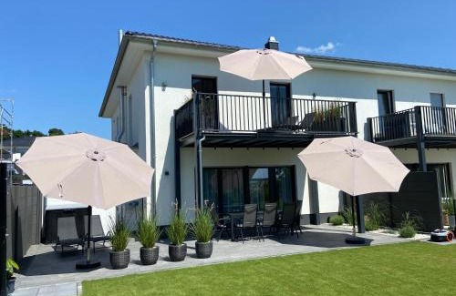 Muldestausee Casa | 8 Personen Ferienhaus ,Seegelblick" am Goitzschesee, erste Reihe am Strand mit Sauna, Kamin, Wallbox & SUP