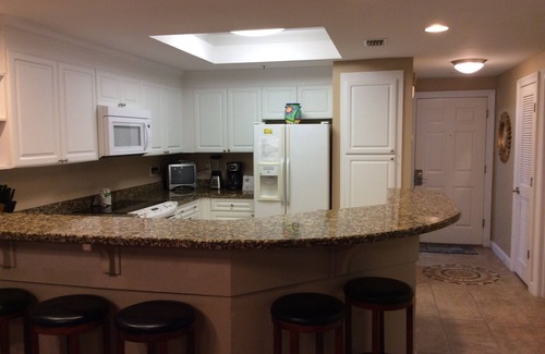 Upper Grand Lagoon Condominio | Un hermoso frente al mar 2BR en Boardwalk-Romanitic Sunset View