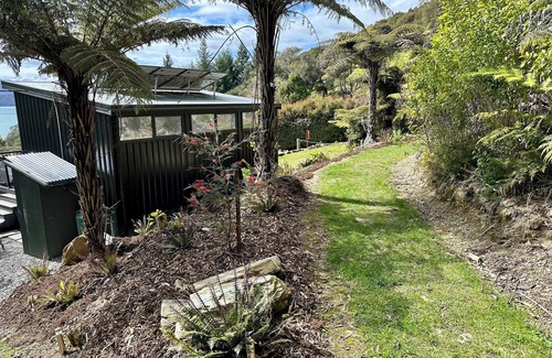 Moetapu Bay Cabina | A cosy two bedroom off-grid cabin, the perfect place to rest, relax & recharge.