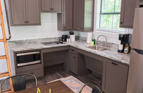 Livingston Cabina | A cozy little ADA accessible getaway right on Kickapoo Creek. Two Creeks Crossing Resort