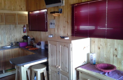 Sabie Cabina | Una cabina de estilo de registro con una habitación principal