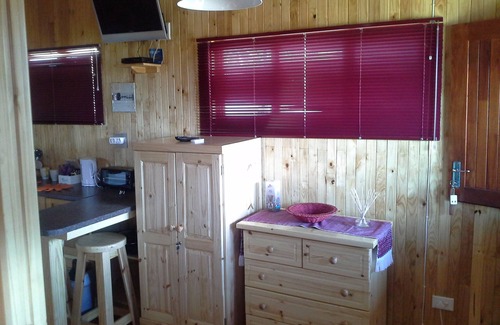 Sabie Cabina | Una cabina de estilo de registro con una habitación principal