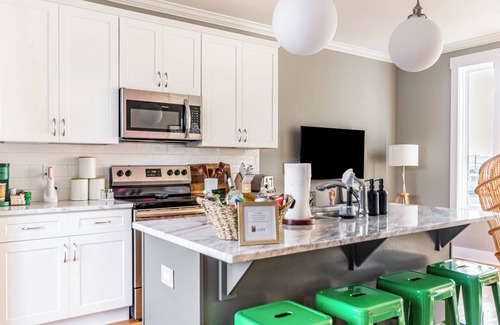 Katie Hill Neighborhood Casa | A modern two-bedroom/2.5 Bathroom townhome in East Nashville. Come enjoy this amazing rooftop! Our home includes a spacious garage for two vehicles. This newly built home is only a 10-min drive to most attractions including Broadway, Nissan Stadium,