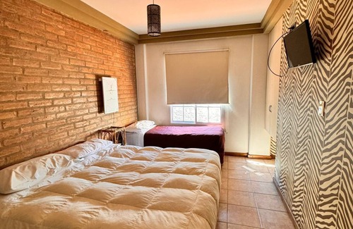 San Juan Hotel | A pocos pasos de puntos de interés turísticos, comerciales y financieros.