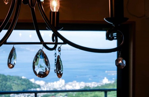 Shimotaga Casa | A spectacular view! Relax on the sea-view terrace / Scandinavian log house with hot spring & fireplace