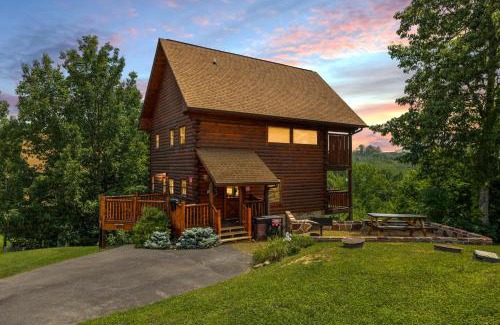 Gatlinburg - Pigeon Forge Casa | A Taste Of Honey is a dog-friendly two bedroom true log cabin nestled inside the Starr Crest resort