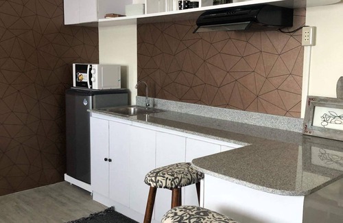 Mandaue Apartamento | Amaia escalones unidad de condominio mandaue muy espaciosa que tiene un área de 30 metros cuadrados.