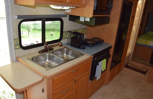 Villars-le-Grand Casa | American Ford Hurricane motorhome, with slide.
