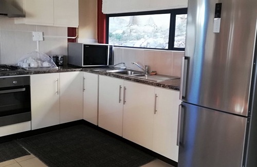 Maseru Apartamento | Una escapada atractiva con un ambiente hogareño, que se asemeja a la comodidad de su hogar.