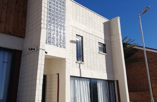 Maseru Apartamento | Una escapada atractiva con un ambiente hogareño, que se asemeja a la comodidad de su hogar.