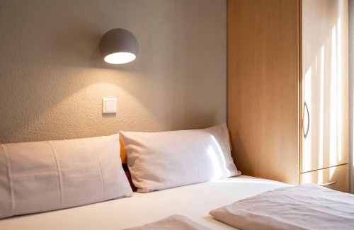 Spiekeroog Apartamento | Antares Spiekerooger Gästehaus-Sonnengartenterrasse West - Wohnung 2