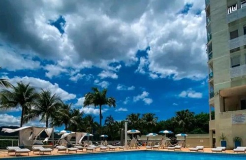 Camboinhas Apartamento | Apart Hotel Alecrim Praia de Camboinhas with Marina standing on the sand