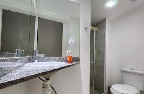 Camboinhas Apartamento | Apart Hotel Alecrim Praia de Camboinhas with Marina standing on the sand