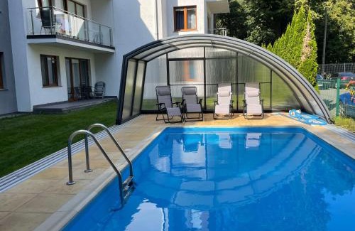 Jastrzebia Gora Apartamento | Apartament z ogródkiem, basen, garaż, rowery Willa 4 Pory Roku