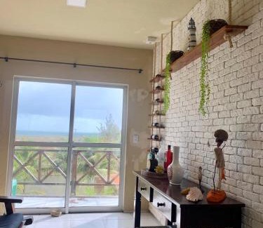 Taiba Apartamento | Apartamento com vista para o mar, piscina , deck , playground e estacionamento .