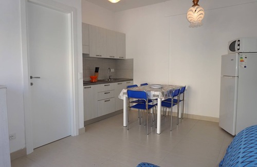 Porto Santa Margherita Apartamento | Apartamento moderno con jardín privado.