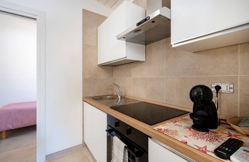 L'Assunta Apartamento | Apartamento 'L'Aia - 4' con piscina compartida, Wi-Fi y aire acondicionado