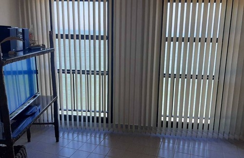 Ipiranga Casa | Apartment on Martim de Sá beach avenue, sea view, foot in the sand