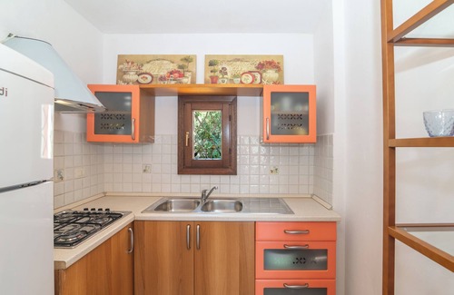 Porto San Paolo Apartamento | Apartamento 'Tavolara Porto San Paolo E2' con vistas al mar, piscina compartida y aire acondicionado